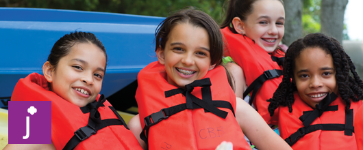 Girl Scout Juniors Junior Girl Scouts smiling in life vests