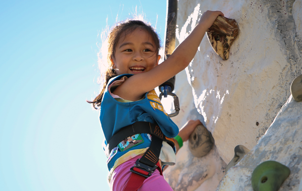 Girl Scout Daisy on rock climbing wall
